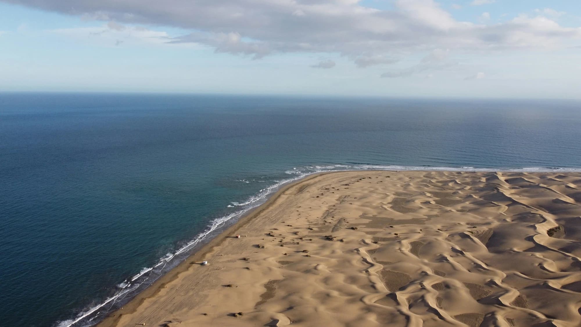 Aerial view of Maspalomas dunes meeting the Atlantic